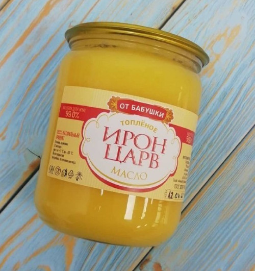 Photograph of a jar of clarified butter, with the label "Iron Tsarv" in cyrillic letters. The jar is clear glass, so that the yellow butter inside is visible. 